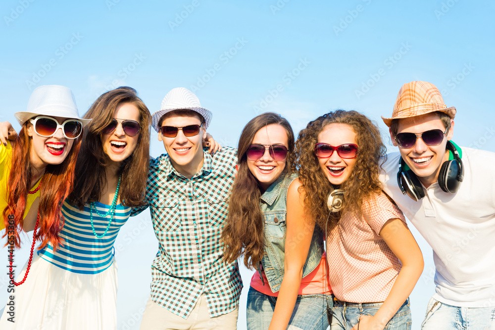 group of young people wearing sunglasses and hat group of young people wearing sunglasses and hat