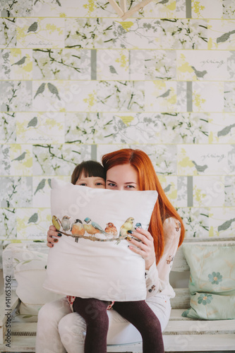 mother and daughter hid under the pillow.