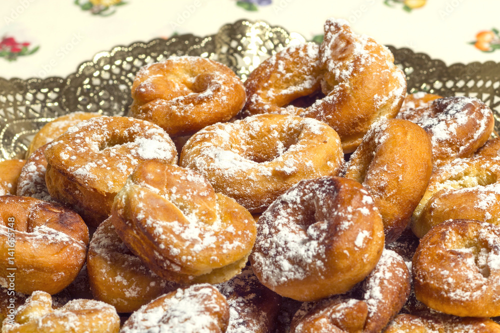 fried donuts of Spain made with dough of flour , yeast, milk, eggs,oil, orange, anise and sugar