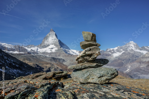 concept of balance, stable and equal stacked rocks on the alp with matterhorn in background, Switzerland © Nuthawut