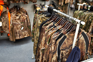 Papier peint photo Chasser Vêtements de chasse et pêche en boutique  © Sergey Ryzhov