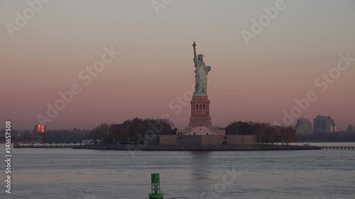 View of the Statue of Liberty and Ellis Island in sunset sunrise, New York State, Manhattan, North America, USA