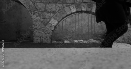 Wallpaper Mural business Man walking in a narrow alley in the city Torontodigital.ca