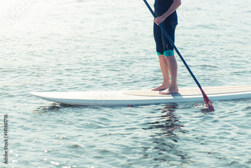 Man on paddleboard © Konstantin Yolshin