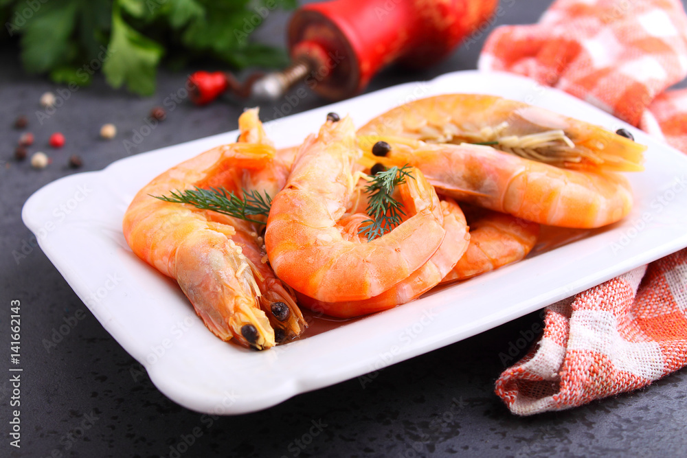 shrimp and dill on a black background shrimp and dill on a black background
