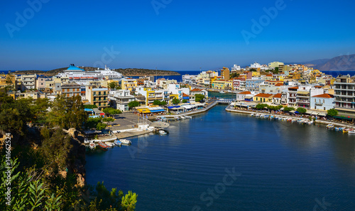 The lake Voulismeni in Agios Nikolaos   a picturesque coastal town with colorful buildings around the port in the eastern part of the island Crete  Greece