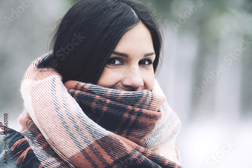 Close up portrait of woman wrapped in scarf photo