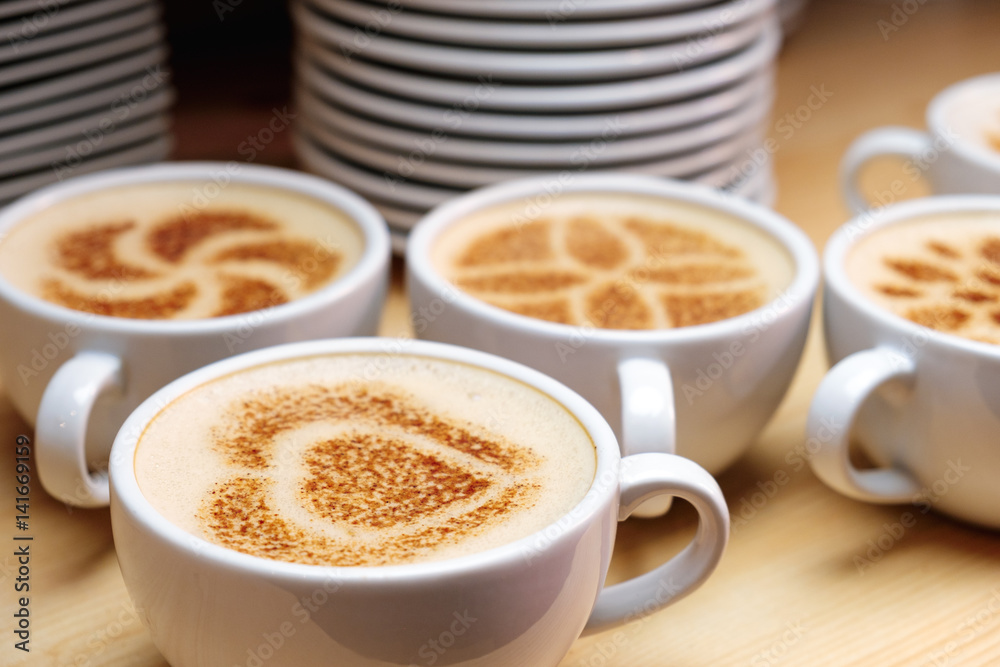 Cup of cappuccino decorated cinnamon