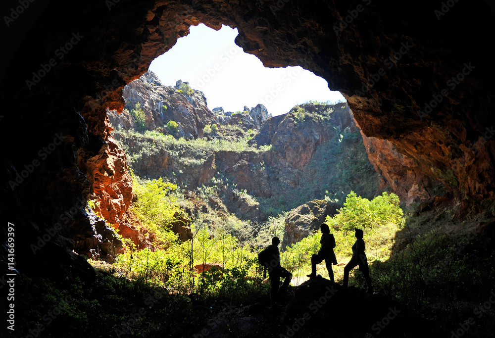 People in the cave, Cerro del Hierro, Natural Park Sierra Norte in Seville, Spain