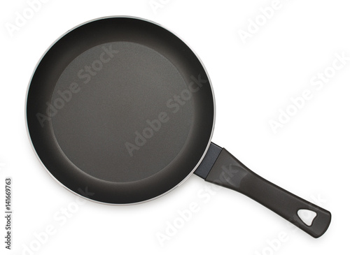 Black frying pan with nonstick surface isolated on white background, close-up, top view.