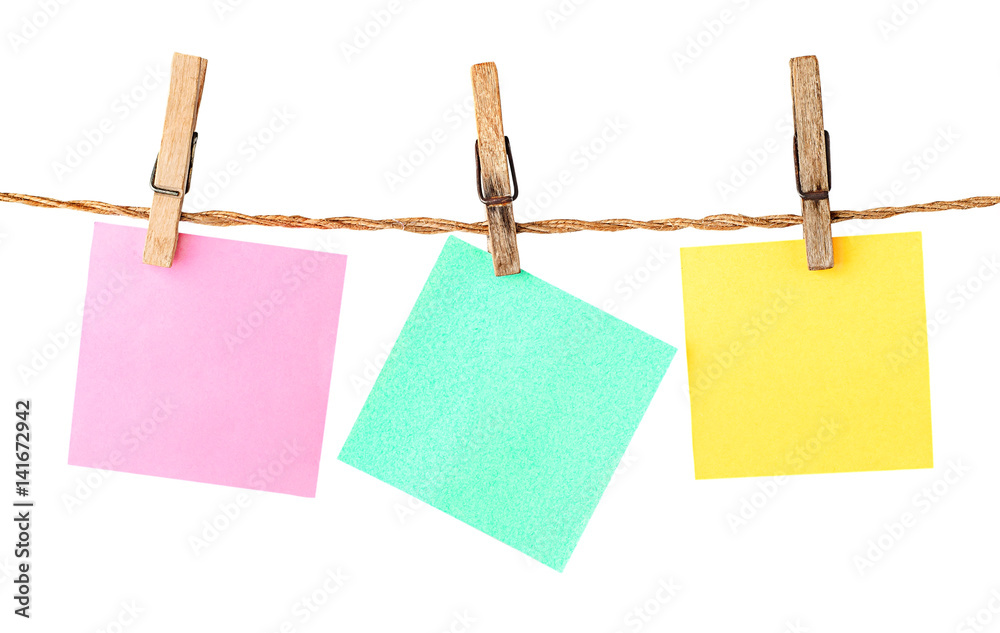 Multicolored paper stickers on clothespins Multicolored paper stickers on clothespins