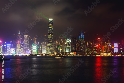 Beautiful super wide-angle summer aerial view View of Hong Kong island skyline, Victoria Bay harbor, with skyscrapers, blue sky and scenery beyond the city, seen from Kowloon island observation Deck