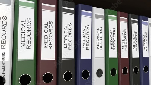 Line of multicolor office binders with Medical records tags. 4K seamless loop clip