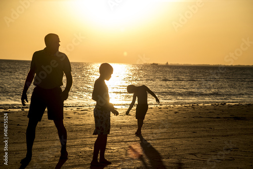 Sunset silhouettes at the beach.