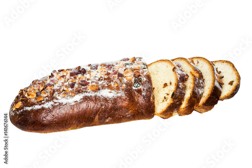 Sliced walnut bread with raisins isolated on a white background