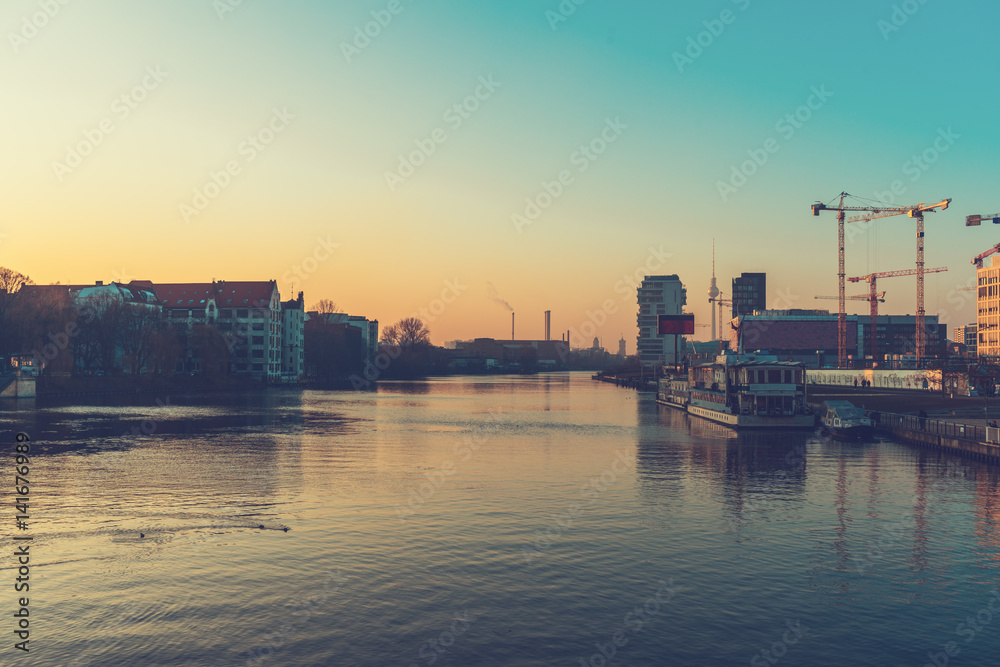 Clear urban waterway with docked boat