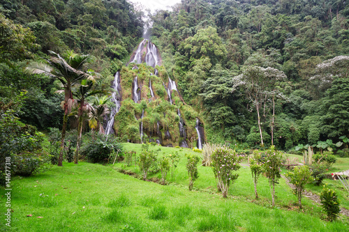 The jungle surrounds the waterfall near the Santa Rosa Thermal Spa in Santa Rosa de Cabal in Colombia. photo