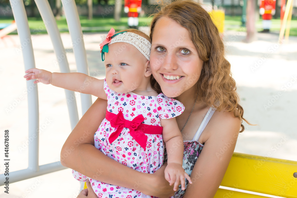mother and preteen daughter summer portrait in the green beautiful park mother and preteen daughter summer portrait in the green beautiful park