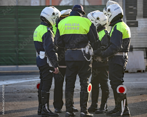 Italian police and some riders with helmet on his head