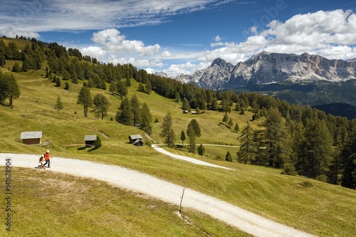 Hiking along the path and meadows of Utia Vaciara, South Tyrol, Dolomites, Italy photo