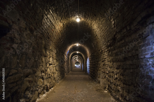 Background of the tunnel from stone and brick walls texture