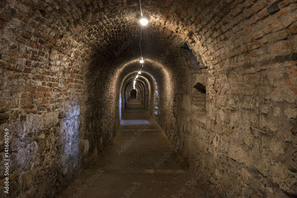 Dark corridor walls under ground with natural lights Budapest Castle Hill