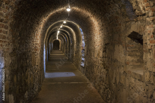 Long dark corridor walls under ground with natural lights Budapest Castle Hill