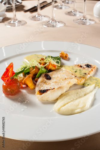 Baked flounder with potato puree and chanterelle salad.