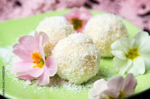 Coconut dessert balls on a plate