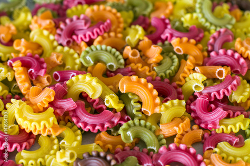 Colorful raw pasta. (Beet, carrot, paprika, spinach, grape seed).  © renvema