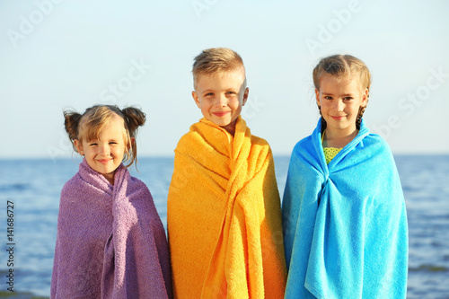 Cute kids wrapped in towel ...