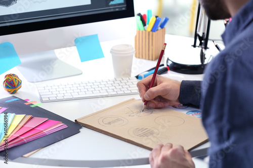 Male designer working in of...
