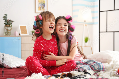 Cute little girls playing w...