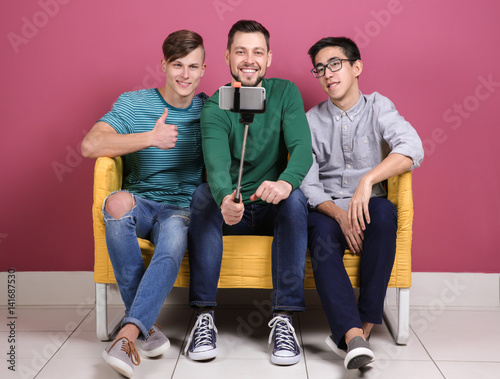 Three diverse young men tak...