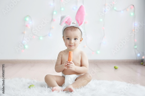Cute little baby in bunny e...