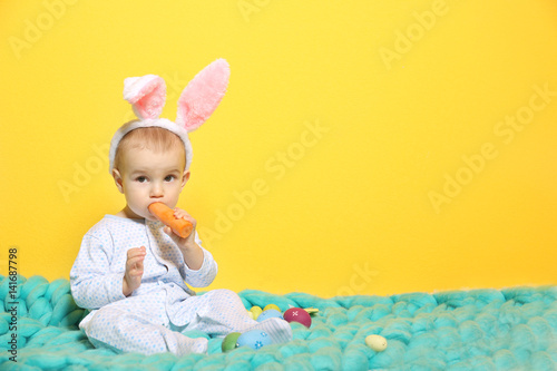 Cute little baby in bunny e...