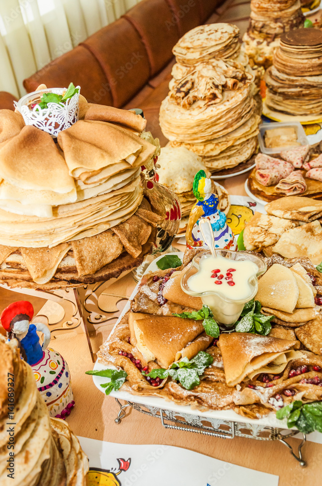 A variety of original pancakes in the contest during the celebration Russian Shrovetide (pancake week) at school