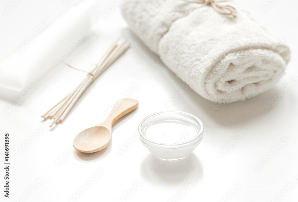 white set of cosmetics for spa on table background