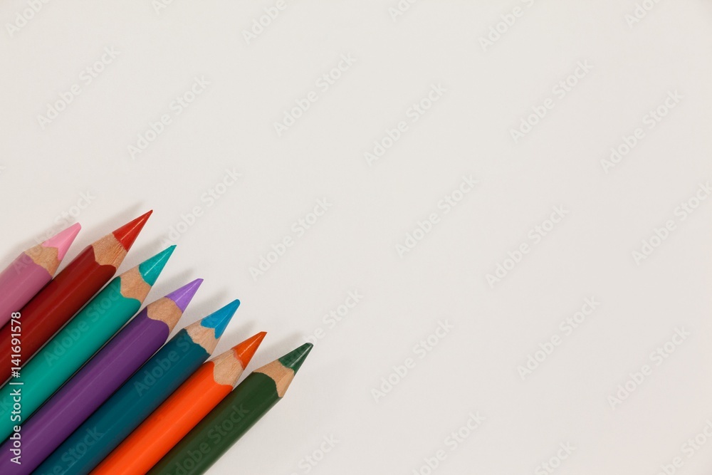 Close-up of colored pencils arranged in a row Close-up of colored pencils arranged in a row