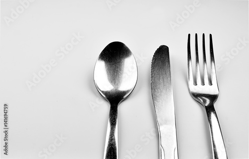 Spoon, Knife and Fork isolated on gray background