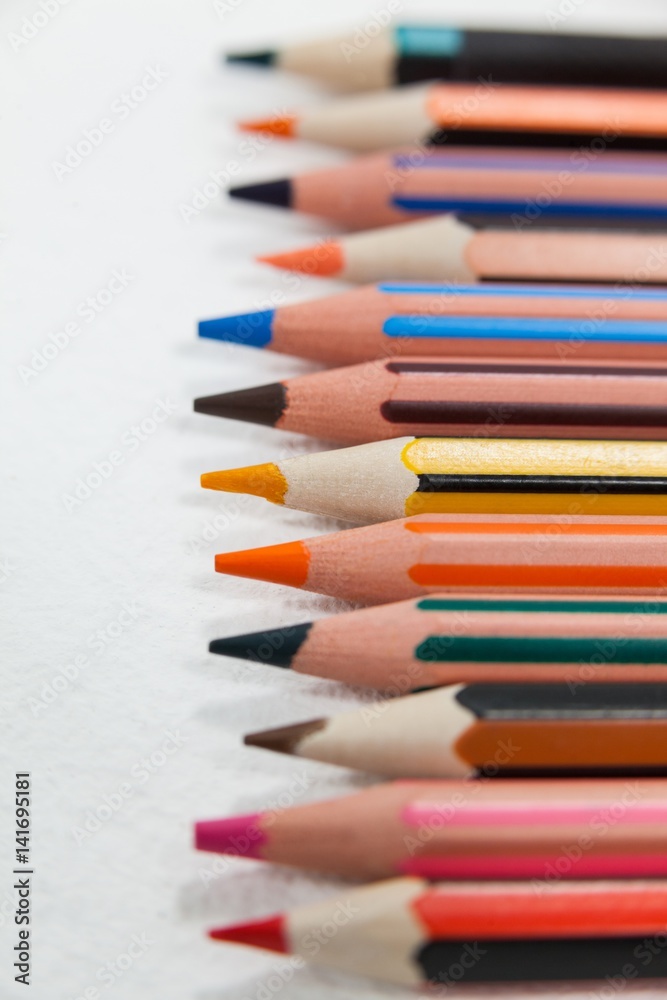 Close-up of colored pencils arranged in a row Close-up of colored pencils arranged in a row
