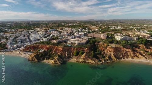 Aerial. Tourist town from the sky Olhos de Agua on the beach shores