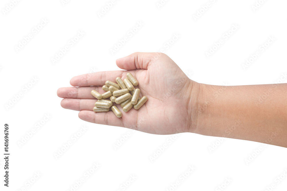 Hand holding medicine pills isolated on white Hand holding medicine pills isolated on white
