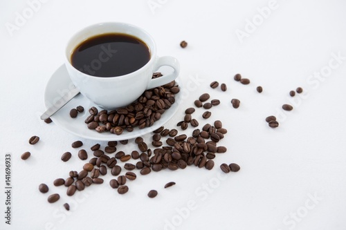 Black coffee with roasted beans