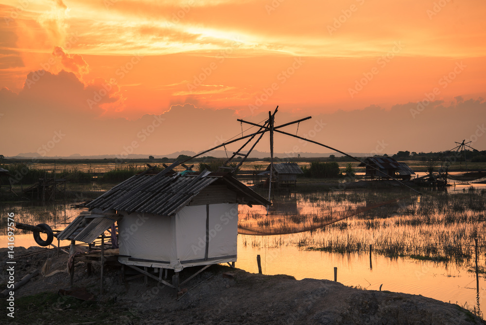 fisherman village with giant fish net at sunset fisherman village with giant fish net at sunset