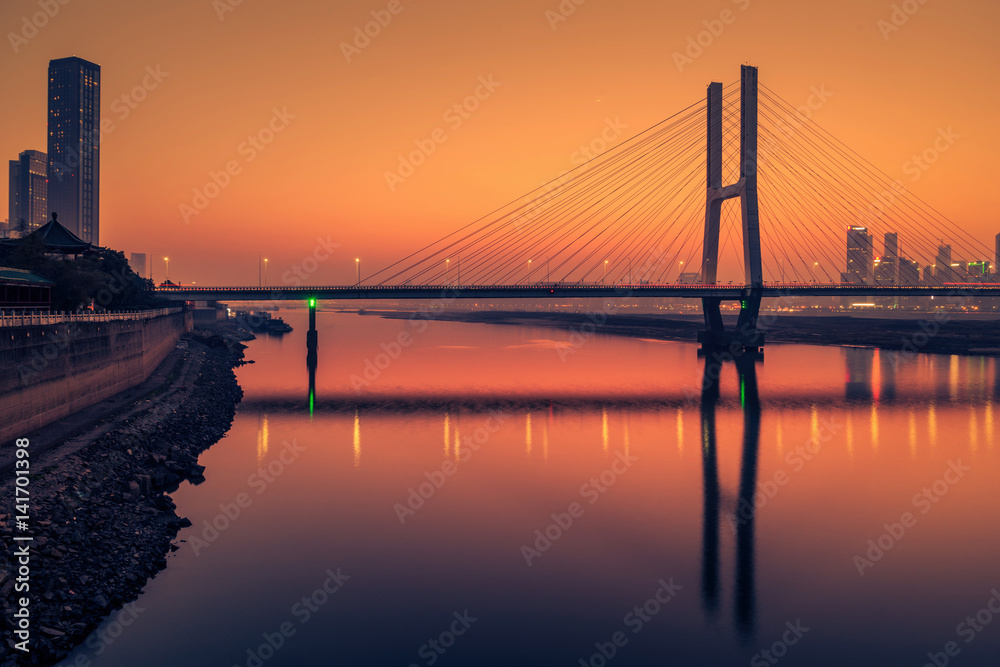 Fototapeta premium sunset view of cityscape along riverside,located in China.