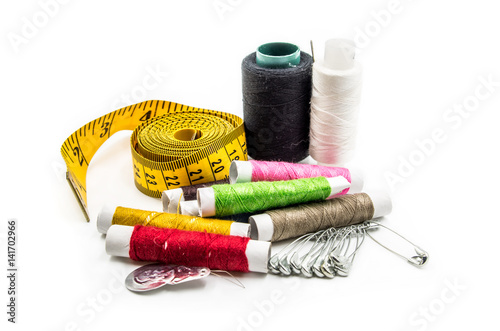 sewing tools on white background photo