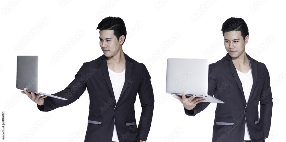 Young asian handsome businessman with computer in hands, isolated on white background