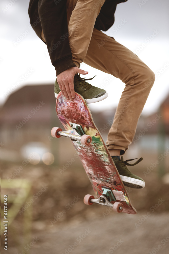 Fotografiet, Poster Close-up of skateboarders foot while skating in skate  park på Europosters.se