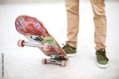 Close-up of skateboarders foot while skating in skate park
